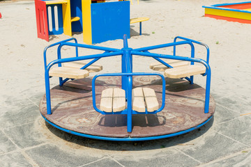 Children's round carousel on the site.
