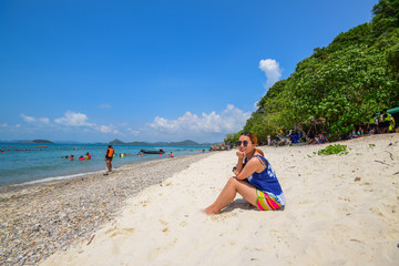 A girl sitting on the beach in Koh Kham Island, Chonburi