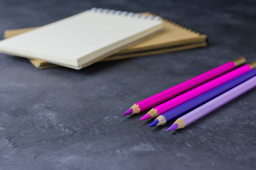 Notepad pile and colored pencils for drawing