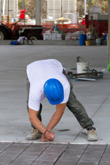 bricklayer at work in building site
