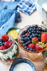 vase with fresh berries, product set for breakfast