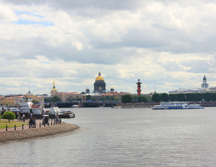 Saint Petersburg (Russia) City Skyline with Cruise Boats on Neva River, St Isaac's Cathedral and Rostral Columns on Background. St. Petersburg Architecture Cityscape View on Dark Cloudy Summer Day.