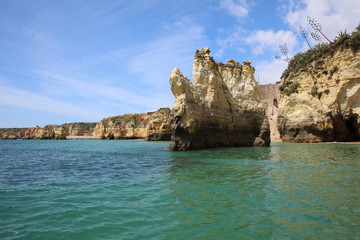 Ponta da Piedade with eroded rock formations and natural arches. Lagos. Portugal