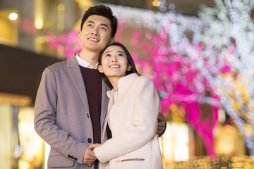 Cheerful young Chinese couple dating