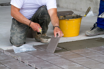 bricklayer at work in building site