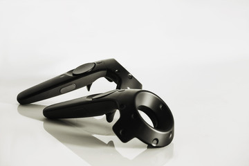 A closeup of a virtual reality controllers on a white background