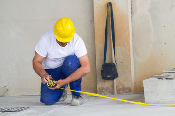 bricklayer at work in building site