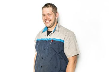 Handsome auto mechanic on white background