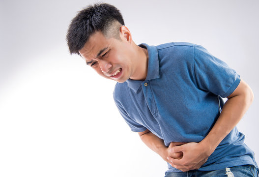 Man Putting His Hands For Belly Or Stomach Ache On White Background