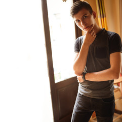 young man posing for photo indoors