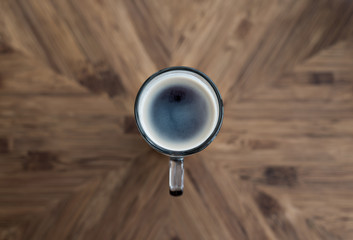 Black coffee in glass on wood table,