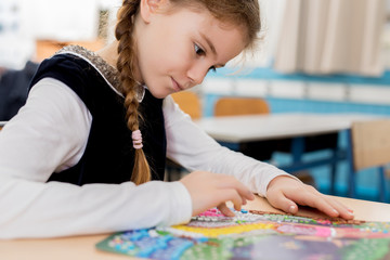 schoolgirl doing art at school