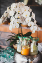 Set of drinks in glass bottles for breakfast, fresh juice, milk, cocktail and milkshakes