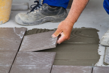 bricklayer at work in building site