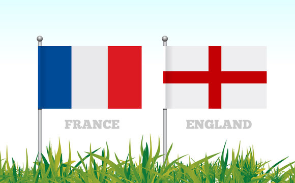 Flags of France and England against the backdrop of grass football stadium.