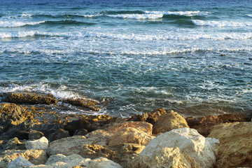 Fototapeta na wymiar Sea, stones, and turquoise water.