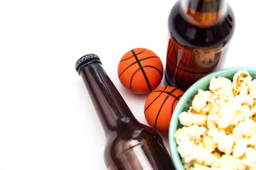 Baasketball match party. Beer bottle with basketball and popcorn