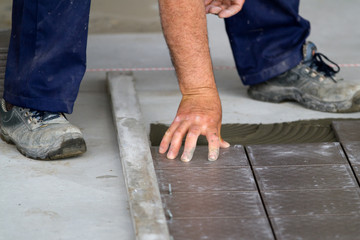 bricklayer at work in building site