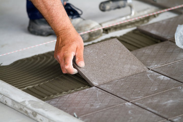 bricklayer at work in building site