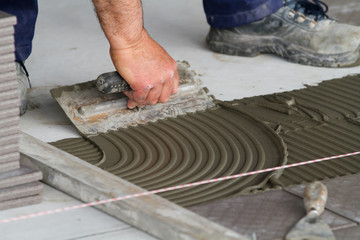 bricklayer at work in building site
