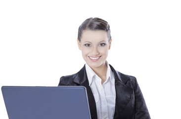 successful business woman is standing with an open laptop