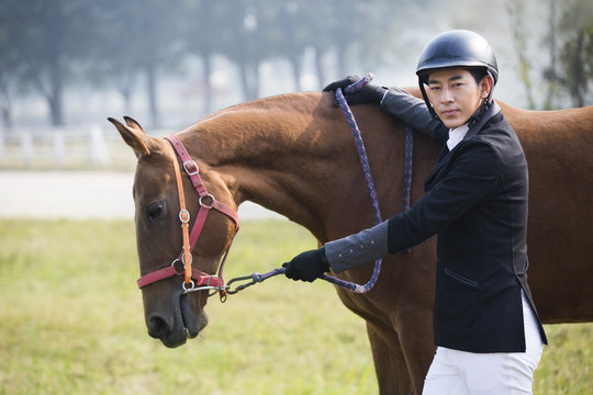 Chinese male rider with his horse 