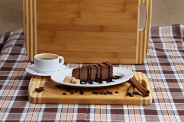 A piece of chocolate cake, cake with coffee and cream, milk close-up