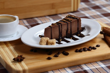 A piece of chocolate cake, cake with coffee and cream, milk close-up