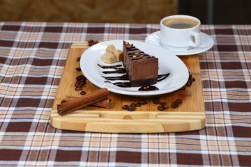 A piece of chocolate cake, cake with coffee and cream, milk close-up