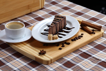 A piece of chocolate cake, cake with coffee and cream, milk close-up