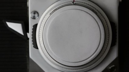 Retro Studio Photography. Close-up view at process of photo-shooting by vintage film camera.