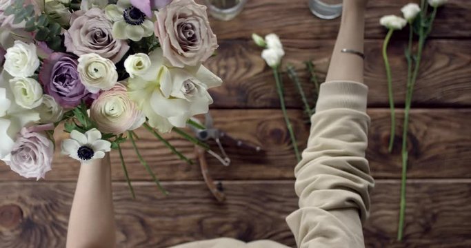 Taking Perfect Flowers for Your Wedding Bouquet. Young florist takes perfect flowers to make a wedding bouquet. Her flowers are wonderful, the colors are so rustic, she has perfect taste