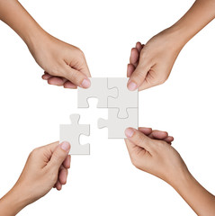Hand holding jigsaw puzzles, Business partnership and teamwork concept