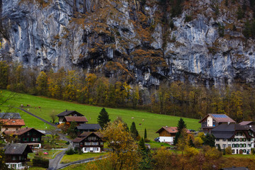 Amazing touristic alpine village with famous church and Staubbach waterfall, Lauterbrunnen,...