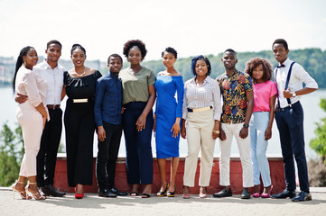 Obraz premium Group of ten african american people posed at street of city. Fashionable people of Africa.