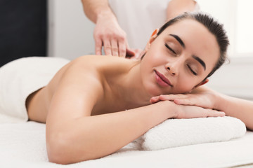 Fototapeta na wymiar Woman getting classical back and neck massage