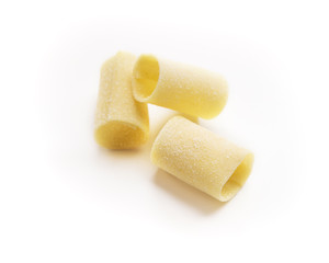 Pile of raw paccheri on white background