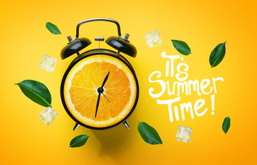 It's Summer Time Typography. Alarm Clock of Orange Fruit Green Leaves and Ice Cube Flying Around on...