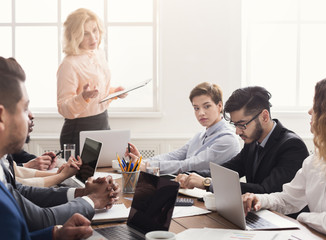 Team leader rebuking employee for mistake