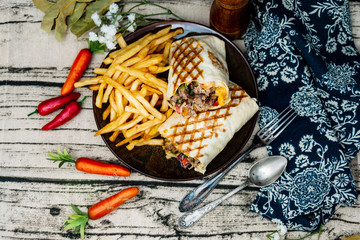 beef tacos served with golden French fries