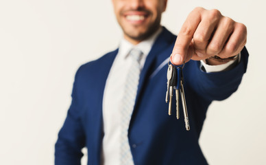 Businessman holding house keys