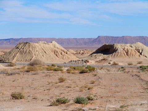 Picturesque panoramic view of Ketthara, a water well at african sandy Sahara desert landscape near Erfoud city, Morocco