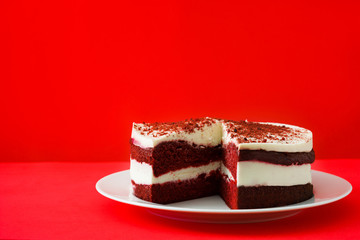 Red Velvet cake on red background. Copyspace