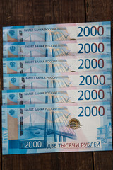 russian banknotes of 2000 rubles on wooden background