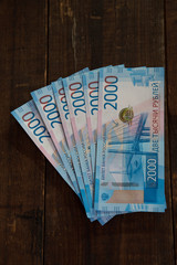 russian banknotes of 2000 rubles on wooden background
