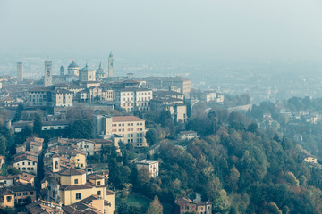 Aerial view of Bergamo in a foggy day, Italy.