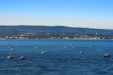 Fototapeta na wymiar Leisure fishing boats in Dardanelles (Canakkale strait)