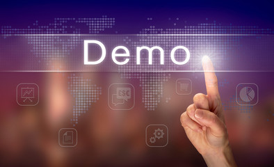 A hand selecting a Demo business concept on a clear screen with a colorful blurred background.