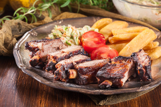 Spicy barbecued pork ribs with french fries