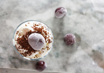 Ice cream with cherry berries on  beautiful marble countertop background